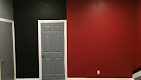 a wall with red black and white pattern in a door