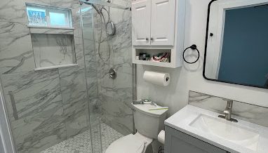 a new modernized bathroom in marble tiles