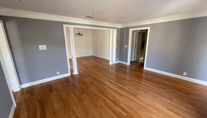 wooden floor with gray walls