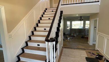 a staircase with a chandelier